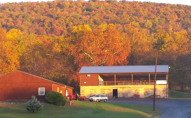 view of barn at sunset
